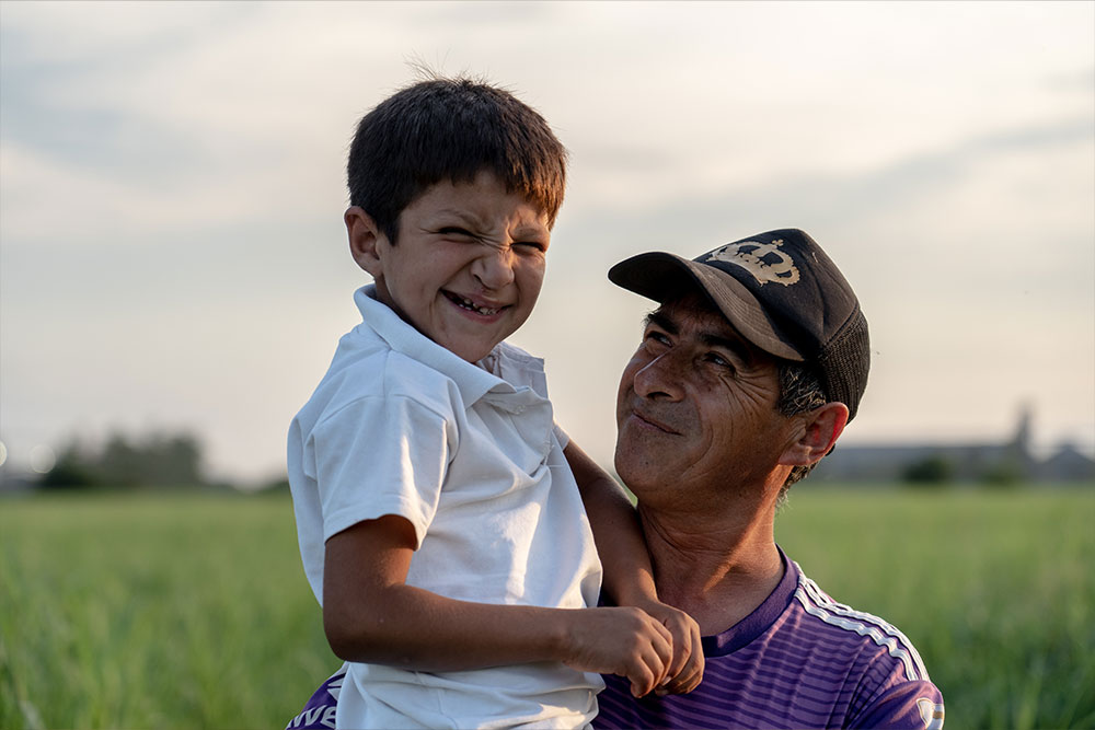 Samir sharing a smile with his dad, Daniel