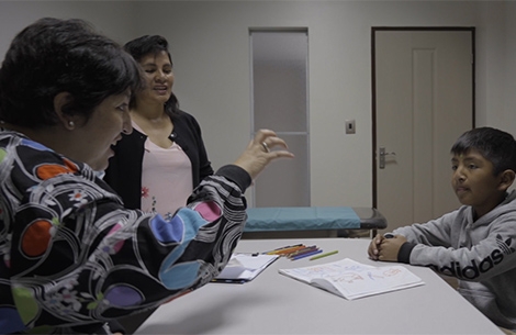 Ingrid Rios giving speech therapy to a Smile Train patient at Fundación Ayninakuna in Sucre, Bolivia