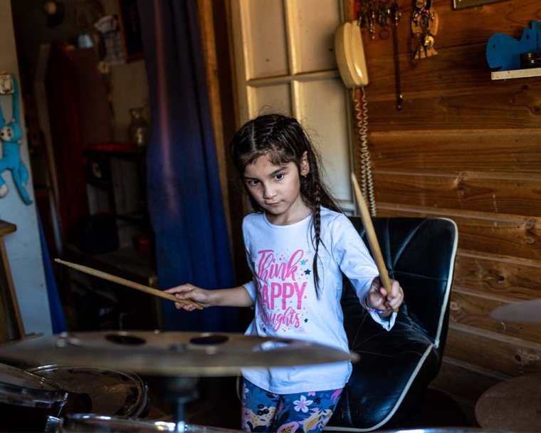 Aylen playing the drums after cleft surgery