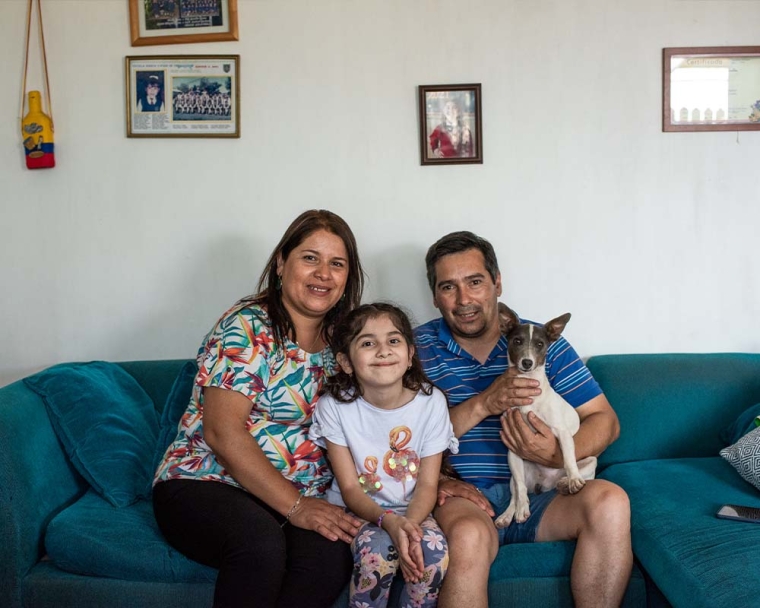 Aylen smiling with her family after cleft surgery